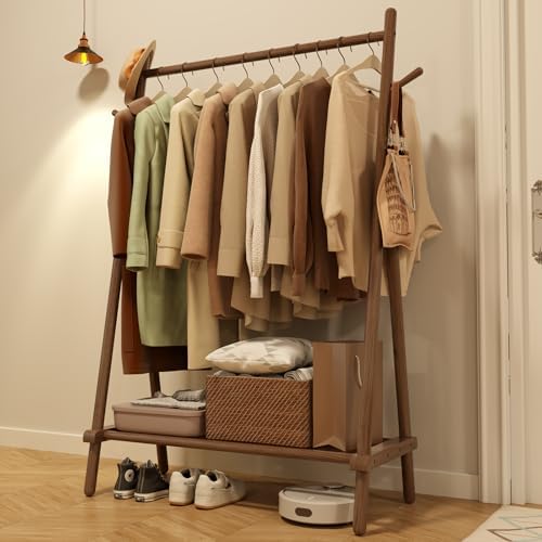 Elegant wooden clothes rail with clothes neatly hung
